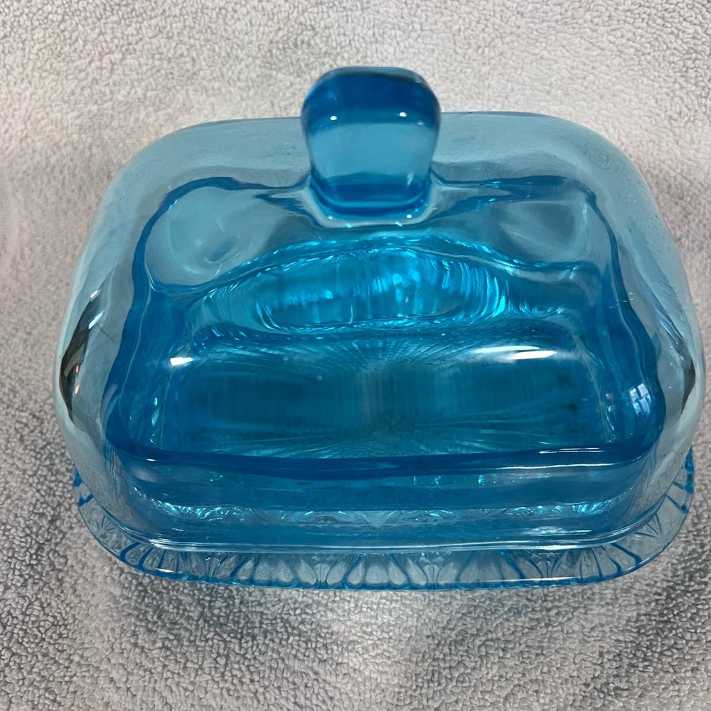 Pretty blue glass butter dish.